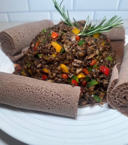 Image showing a homemade Ethiopian Mushroom Dulet served with injera