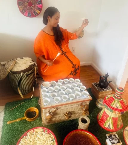 Ethiopian woman preparing the traditional Ethiopian Coffee